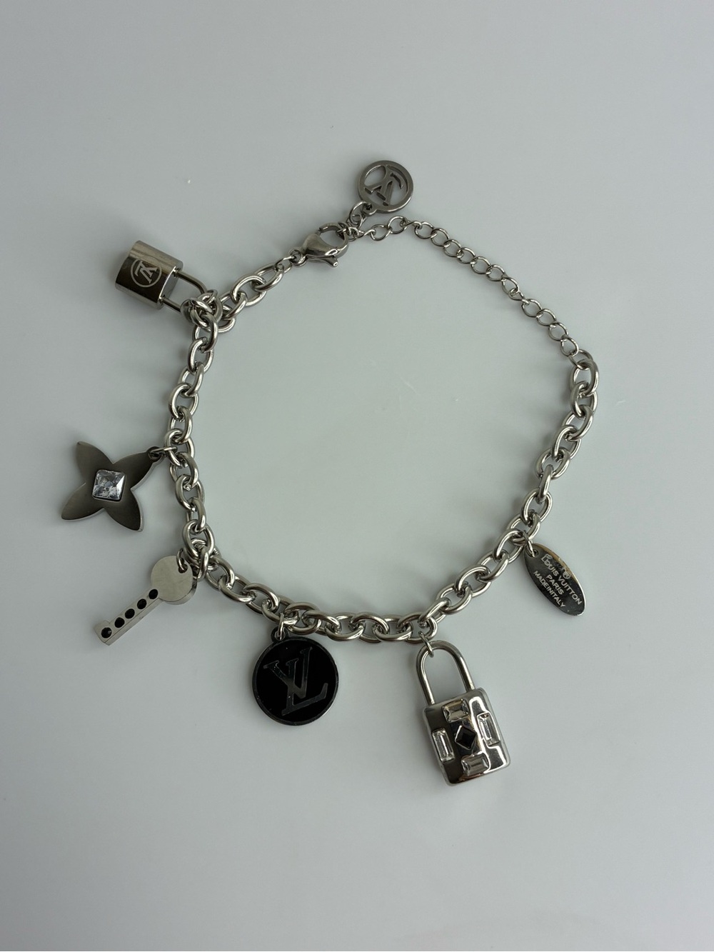 Vintage Silver Charm Bracelet with Lock and Logo Medallion